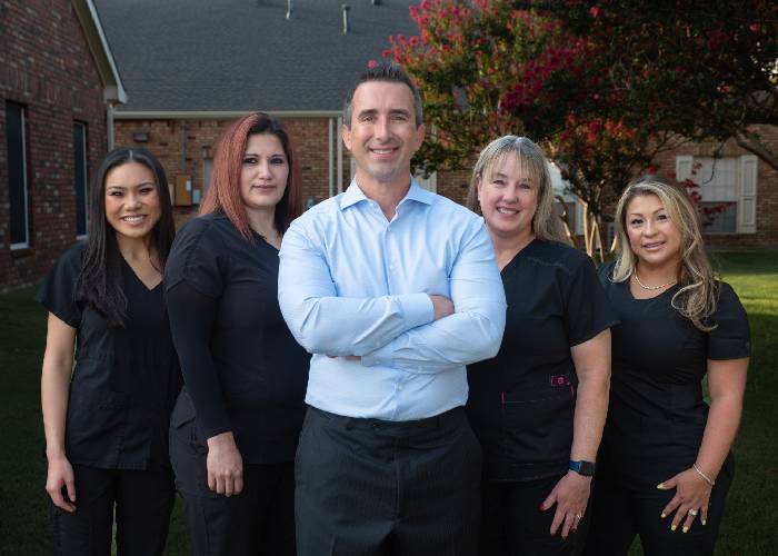 The Thomas Simmons DDS team smiling