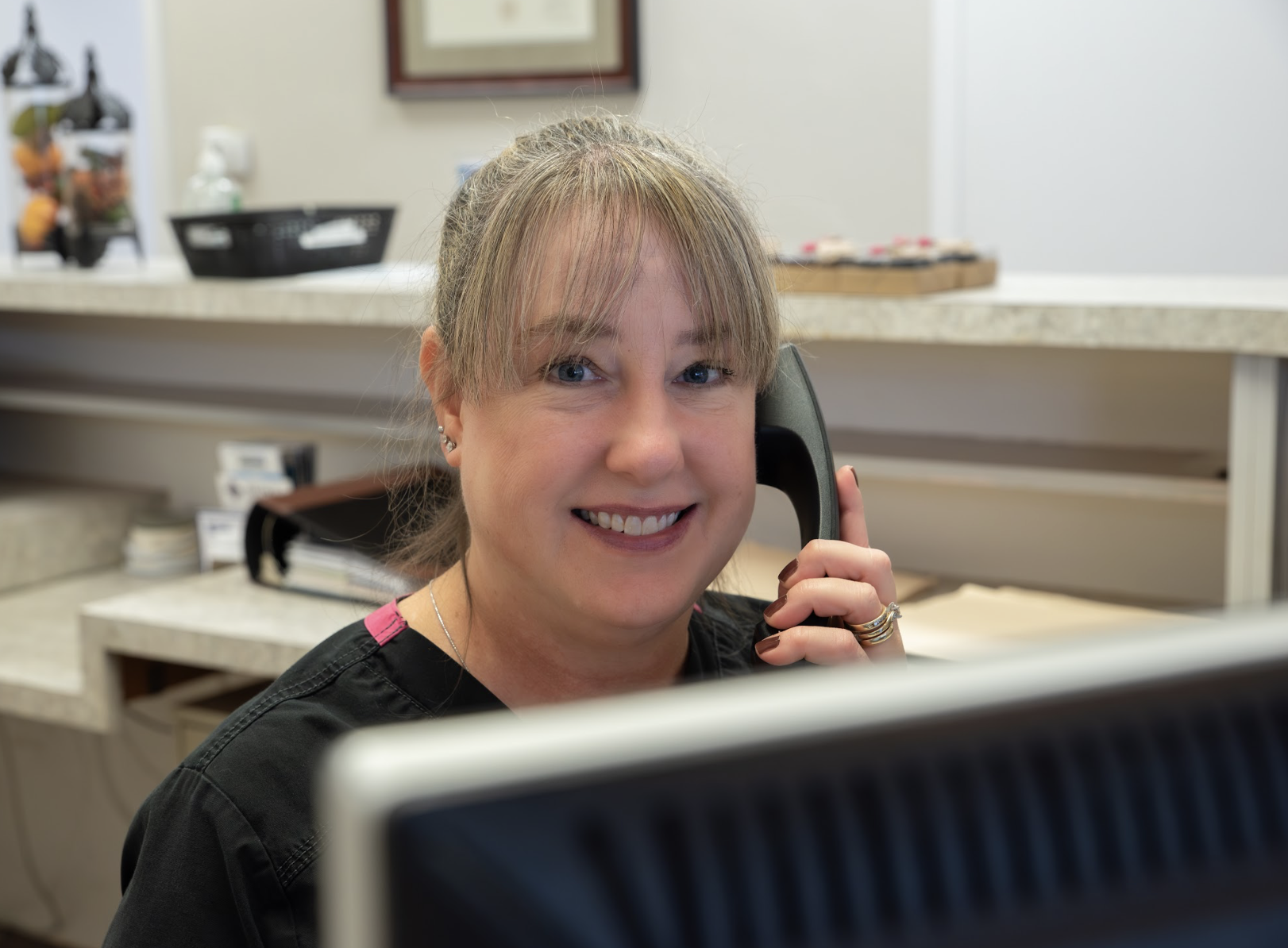 patient learning about invisalign clear aligners in plano, tx