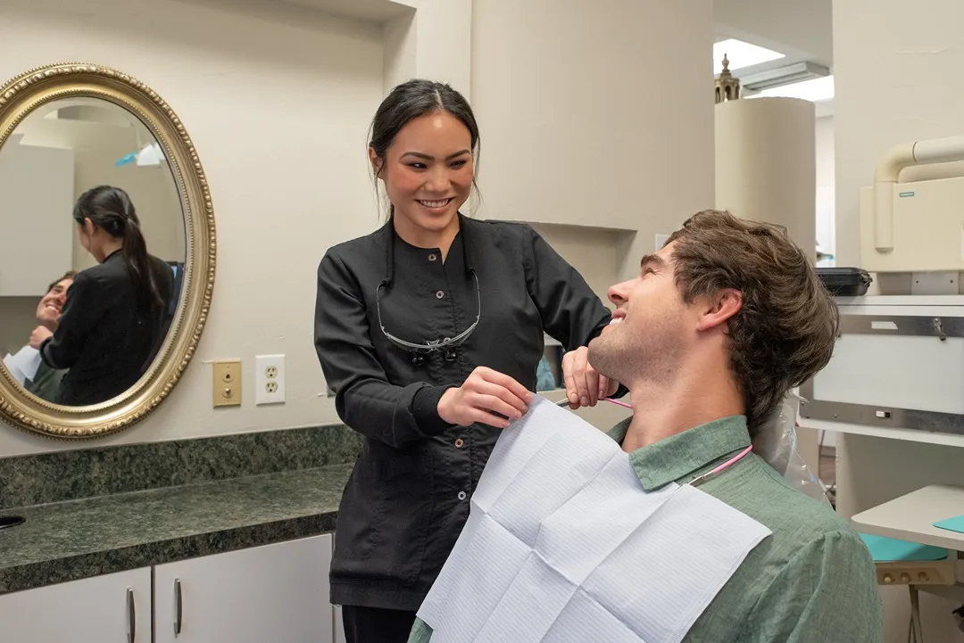 Hygienist helping a patient of Dr. Simmons