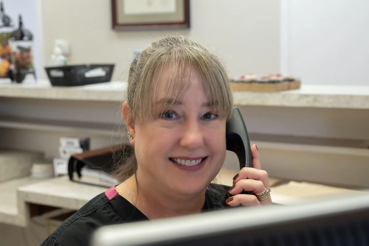 patient learning about invisalign clear aligners in plano, tx